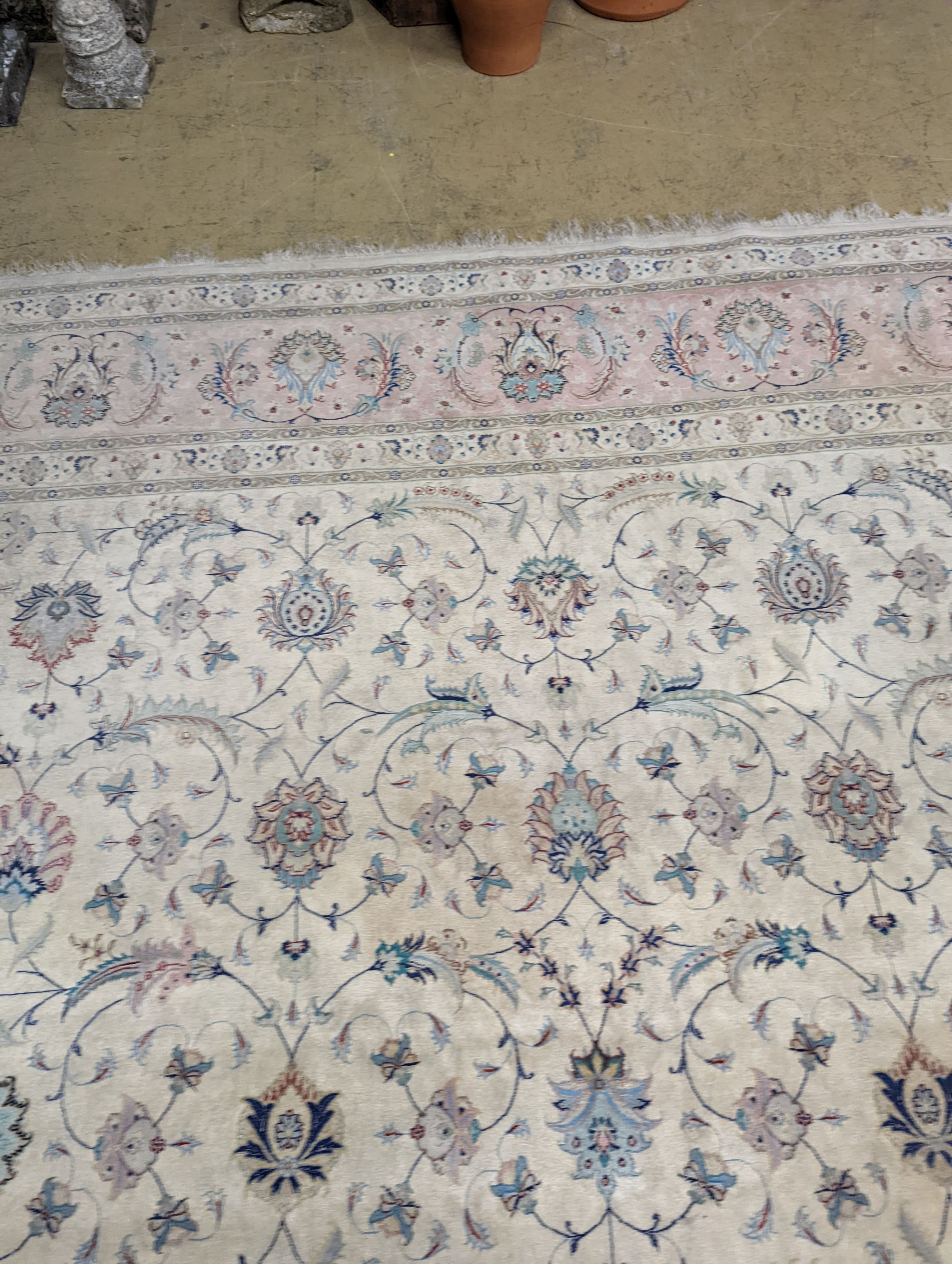 A Persian Tabriz ivory ground carpet, 410 x 300cm